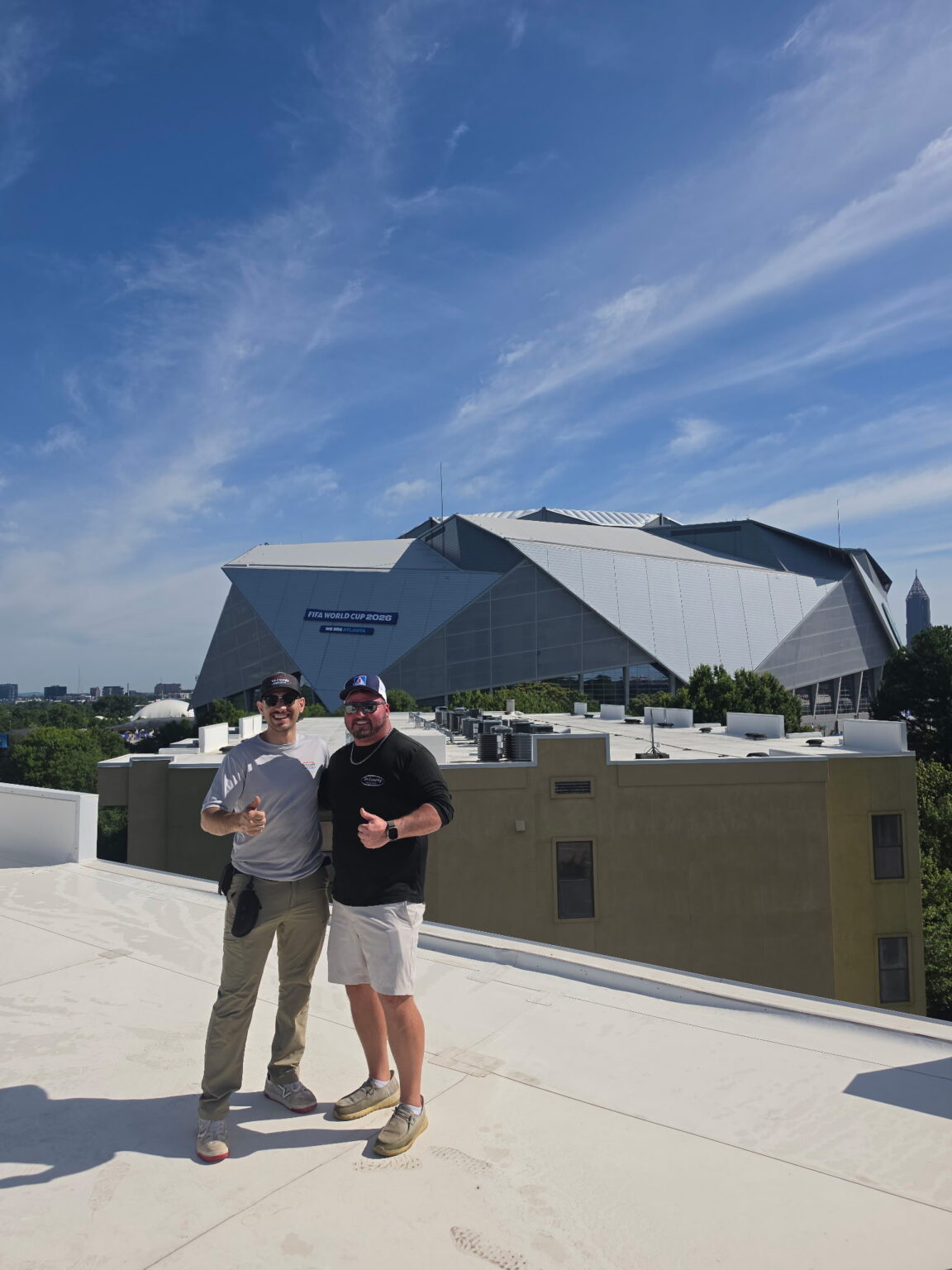 Team members outside a commercial building