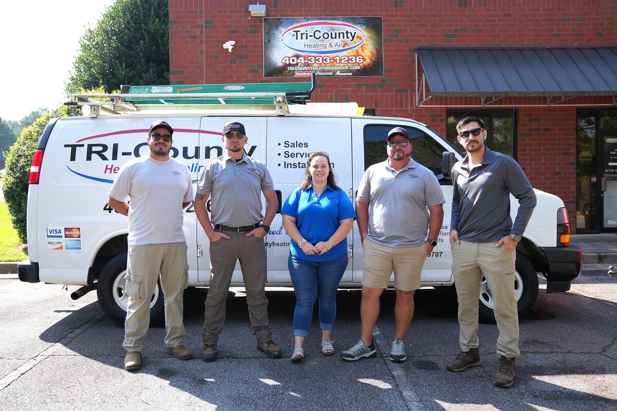 Tri-County Heating & Air team standing outside the company building