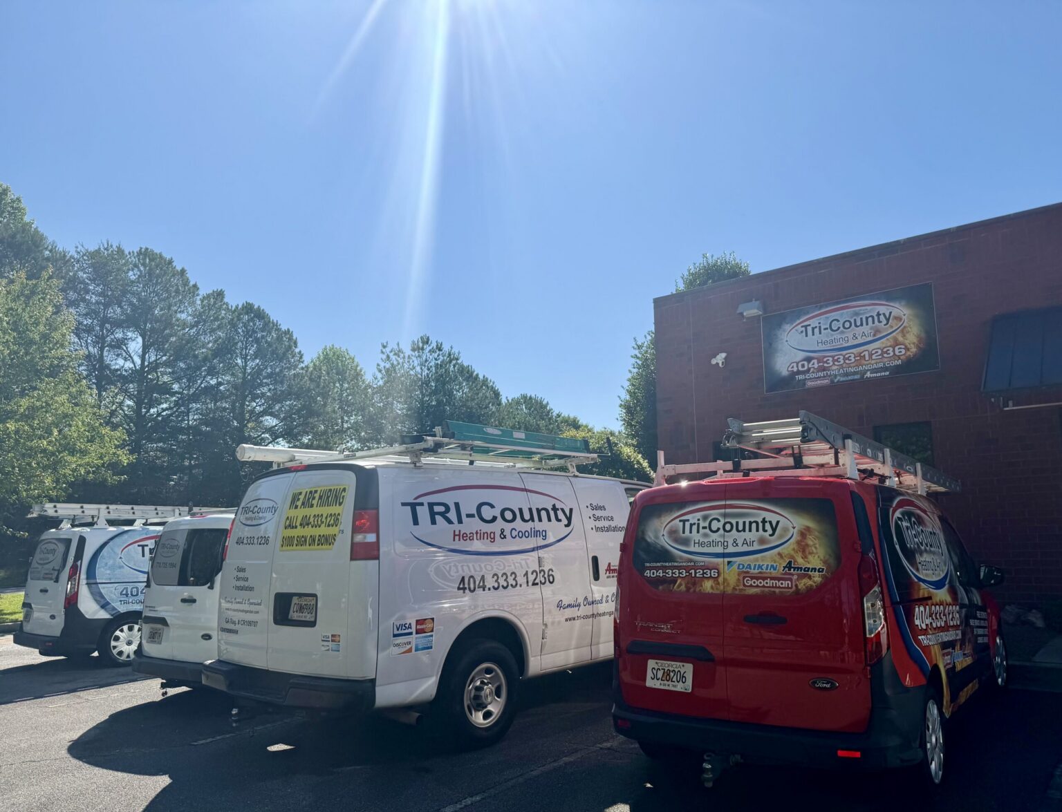 Tri-County Heating & Air service vehicles outside the company office